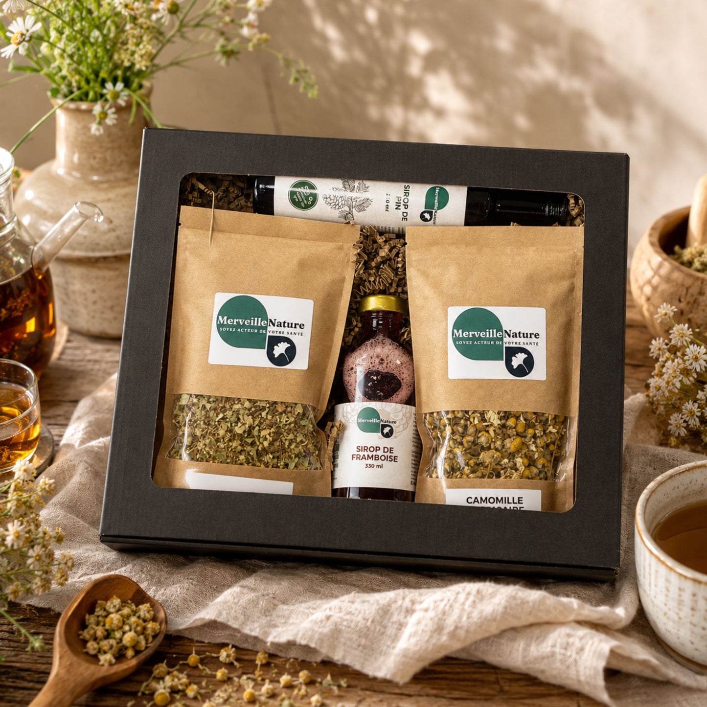 Coffret bien-être MerveilleNature en scène lifestyle avec tisanes naturelles et sirop artisanaux, parfait pour un moment détente et santé.